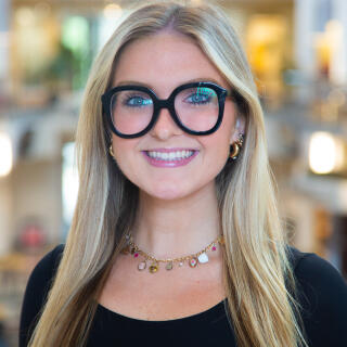 Profile photo of Delanie Householder standing in the Great Hall of the Ohio Union